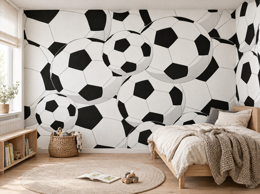 Papier peint ballons de foot posé dans une chambre d'enfant