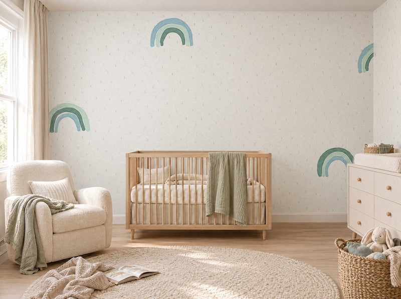 Papier peint petits arcs-en-ciel posé dans une chambre de bébé